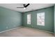 Bright bedroom with modern ceiling fan and natural light from two windows at 904 Churchill Glen Blvd, Knightdale, NC 27545