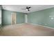 A spacious bedroom featuring neutral carpet and a modern ceiling fan at 904 Churchill Glen Blvd, Knightdale, NC 27545