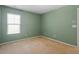 Bedroom featuring carpeted floors and ample natural light from the window at 904 Churchill Glen Blvd, Knightdale, NC 27545