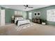 Relaxing bedroom with king bed, carpet floors, and soothing light-green walls at 904 Churchill Glen Blvd, Knightdale, NC 27545