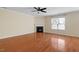 The living room features hardwood floors, neutral walls, crown molding, and a modern fireplace at 904 Churchill Glen Blvd, Knightdale, NC 27545