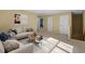 A living room featuring modern sofas and a carpeted floor at 904 Churchill Glen Blvd, Knightdale, NC 27545