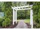 Inviting walking path through lush greenery, leading to a peaceful retreat for residents at 904 Churchill Glen Blvd, Knightdale, NC 27545