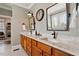 Double vanity bathroom features modern fixtures, granite countertops, and decorative mirrors at 907 Vintage Hill Pkwy, Durham, NC 27712