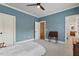 Comfortable bedroom with blue walls, soft carpet, and decorative lighting at 907 Vintage Hill Pkwy, Durham, NC 27712