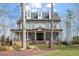 Charming two-story home with stone accents, inviting front porch, and well-manicured lawn at 907 Vintage Hill Pkwy, Durham, NC 27712