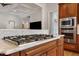 Kitchen with a cooktop in the center island and stainless steel appliances at 907 Vintage Hill Pkwy, Durham, NC 27712