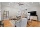Bright living room features hardwood floors, coffered ceiling, and stylish furniture at 907 Vintage Hill Pkwy, Durham, NC 27712
