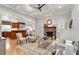 Spacious living room with a stone fireplace, coffered ceiling, and hardwood flooring at 907 Vintage Hill Pkwy, Durham, NC 27712