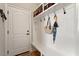Well-organized mudroom with a bench, coat hooks, and storage baskets for an efficient entryway at 907 Vintage Hill Pkwy, Durham, NC 27712