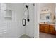 Bathroom shower features white subway tile, black trim, and built-in niche at 907 Vintage Hill Pkwy, Durham, NC 27712