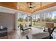 Cozy sunroom filled with natural light, comfortable seating, and serene backyard views at 907 Vintage Hill Pkwy, Durham, NC 27712