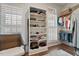 Walk-in closet features custom shelving and plenty of space for an organized wardrobe at 907 Vintage Hill Pkwy, Durham, NC 27712
