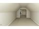 Spacious attic featuring neutral carpeting, white walls, and an open concept at 9244 Palm Bay Cir, Raleigh, NC 27617