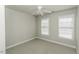 Bright bedroom with neutral carpet and ceiling fan at 9244 Palm Bay Cir, Raleigh, NC 27617