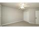 Neutral bedroom featuring a ceiling fan and closet at 9244 Palm Bay Cir, Raleigh, NC 27617
