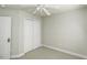 Simple bedroom with neutral carpeting, white walls, and double door closet at 9244 Palm Bay Cir, Raleigh, NC 27617