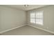 Neutral carpeted room with natural light from a window at 9244 Palm Bay Cir, Raleigh, NC 27617