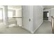 Bright hallway with carpeted floor leading to bedrooms at 9244 Palm Bay Cir, Raleigh, NC 27617