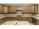 Kitchen featuring granite countertops, modern appliances, and plenty of cabinet space for storage at 9244 Palm Bay Cir, Raleigh, NC 27617