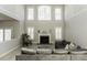 Bright living room featuring a fireplace, high ceilings, and ample natural light at 9244 Palm Bay Cir, Raleigh, NC 27617