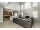 Spacious living room with fireplace, soaring ceilings, and views to the kitchen at 9244 Palm Bay Cir, Raleigh, NC 27617