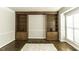Spacious living room with hardwood floors and custom built-in shelving at 9244 Palm Bay Cir, Raleigh, NC 27617