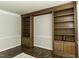 Spacious living room with hardwood floors and custom built-in shelving at 9244 Palm Bay Cir, Raleigh, NC 27617