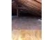 View of an attic with unfinished wood and ceiling beams at 103 W Thorndale Dr, Oxford, NC 27565