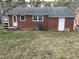 Brick house with backyard access, steps, and small greenery at 103 W Thorndale Dr, Oxford, NC 27565