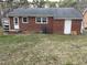 Brick home with a spacious backyard, showcasing a classic exterior design at 103 W Thorndale Dr, Oxford, NC 27565