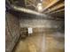 Basement view with utility features and brick foundation at 103 W Thorndale Dr, Oxford, NC 27565