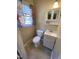 Small bathroom with white toilet, sink, and cabinet at 103 W Thorndale Dr, Oxford, NC 27565