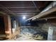 Crawl space under home with vapor barrier, water heater, brick foundation, and some visible ductwork at 103 W Thorndale Dr, Oxford, NC 27565