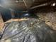Crawl space with plastic liner under brick foundation at 103 W Thorndale Dr, Oxford, NC 27565