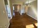Dining area featuring hardwood floors, stainless steel appliances, and neutral walls at 103 W Thorndale Dr, Oxford, NC 27565
