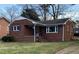 Beautiful single-Gathering home featuring classic brickwork and a manicured lawn at 103 W Thorndale Dr, Oxford, NC 27565