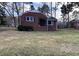 Charming brick home featuring a cozy front porch and well-maintained lawn at 103 W Thorndale Dr, Oxford, NC 27565