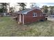 This brick home features a well-maintained yard and classic architectural details at 103 W Thorndale Dr, Oxford, NC 27565