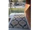 Inviting front porch with colorful rug and brick accents at 103 W Thorndale Dr, Oxford, NC 27565
