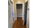 Hallway featuring gleaming hardwood floors and neutral walls at 103 W Thorndale Dr, Oxford, NC 27565