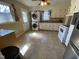 Functional kitchen featuring white appliances, modern washer and dryer, and rainbow light reflection at 103 W Thorndale Dr, Oxford, NC 27565