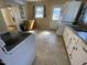 Cozy laundry room area featuring a washer, dryer, and natural light at 103 W Thorndale Dr, Oxford, NC 27565