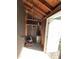 Inside shed with storage shelves, lawnmower, and a small filing cabinet at 103 W Thorndale Dr, Oxford, NC 27565