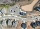 Aerial view of a community clubhouse, parking, pond, and homes in development at 1067 Fairhaven Dr # 53, Mebane, NC 27302