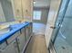 Bathroom leading to a bedroom, with a vanity, sinks and glass-door shower at 1067 Fairhaven Dr # 53, Mebane, NC 27302