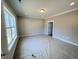 Spacious bedroom showcasing carpeted flooring, recessed lighting, and natural light at 1067 Fairhaven Dr # 53, Mebane, NC 27302
