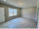 Well-lit bedroom featuring carpet, a ceiling light and bright natural light at 1067 Fairhaven Dr # 53, Mebane, NC 27302