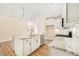 Kitchen features a center island, stainless appliances, and granite countertops at 1067 Fairhaven Dr # 53, Mebane, NC 27302