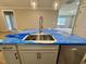 Kitchen island features a stainless steel double sink, Whirlpool dishwasher, and gray cabinets at 1067 Fairhaven Dr # 53, Mebane, NC 27302